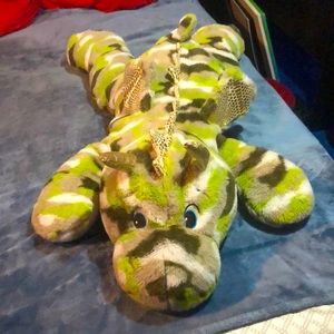 Plush dragon around 3 feet in length with gold, green, brown, and white.